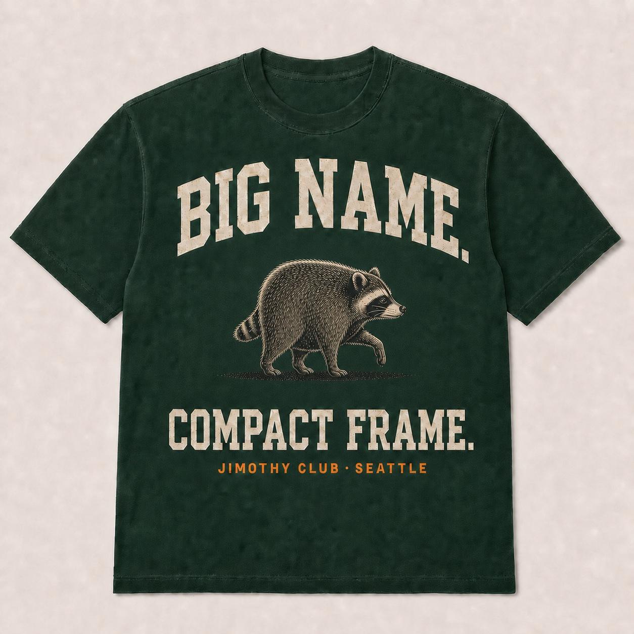 Evergreen Big Name Compact Frame T-shirt featuring a compact raccoon illustration