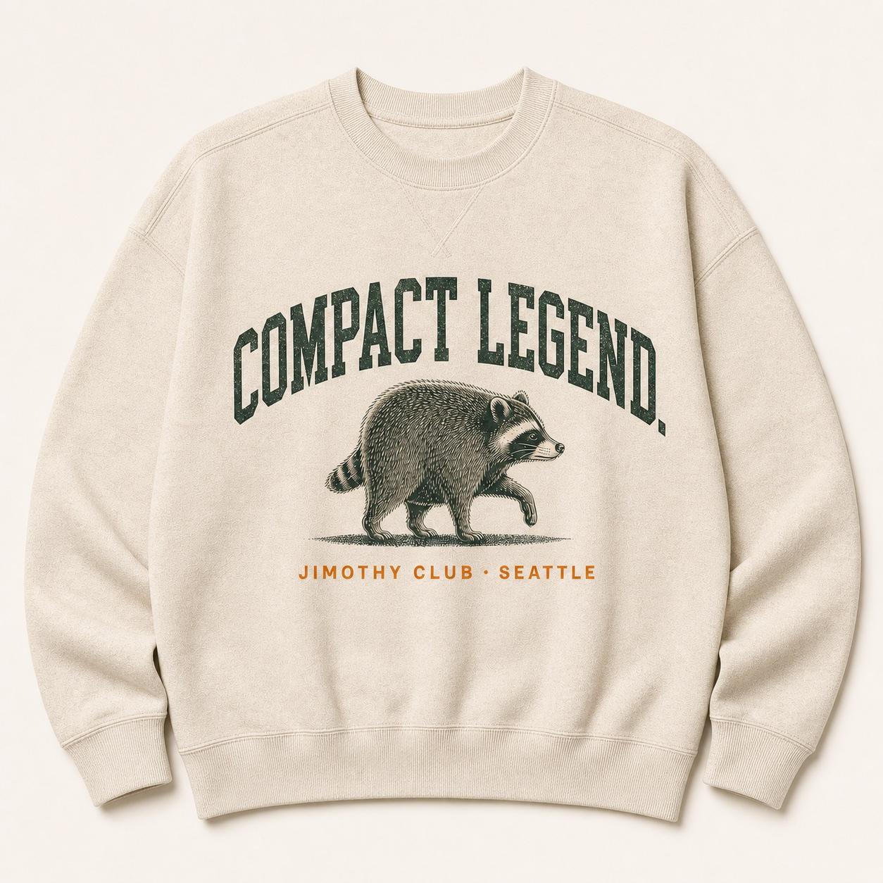 Oatmeal Compact Legend crewneck with a compact raccoon illustration